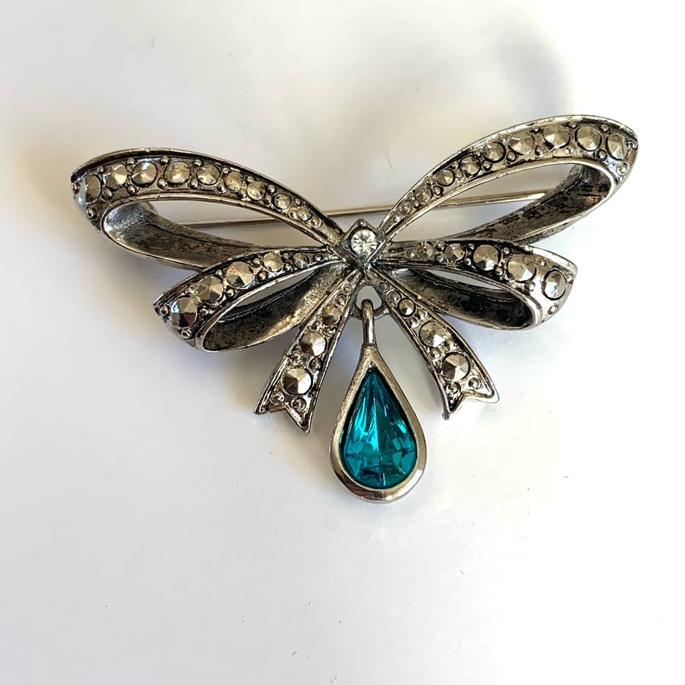Vintage Avon Bow Brooch Faux marcasite and Blue Gem Dangle. December Birthstone